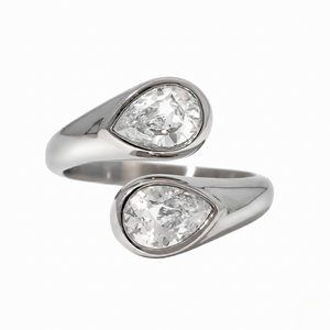 Modern teardrop ring with two clear gemstones set in sleek silver, open band design