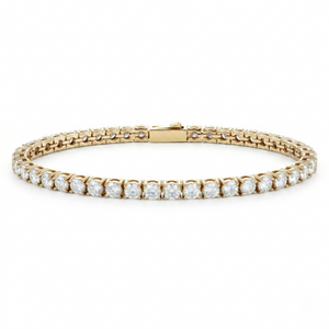 Gold tennis bracelet with 5mm round diamonds in a classic style.