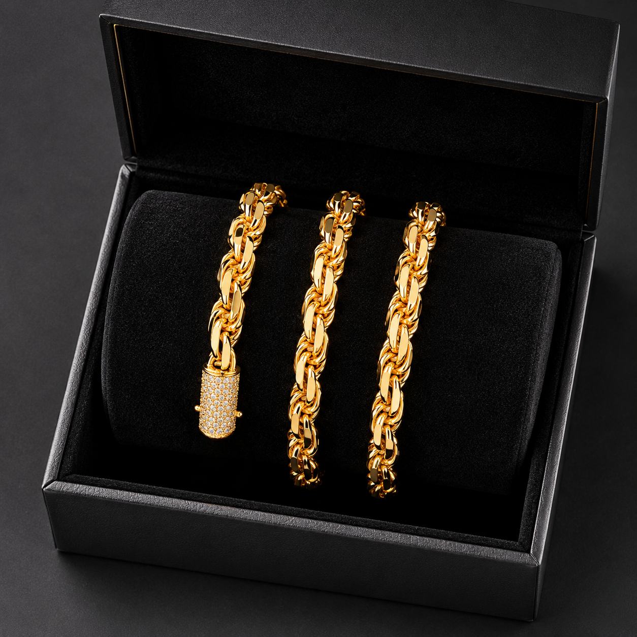 Heavy gold rope bracelet featuring a diamond-encrusted barrel clasp displayed inside a luxury black gift box | J.Collins Jewelry