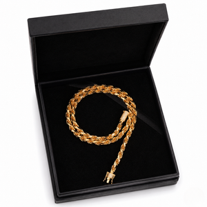 Heavy gold rope bracelet featuring a diamond-encrusted barrel clasp displayed inside a luxury black gift box | J.Collins Jewelry