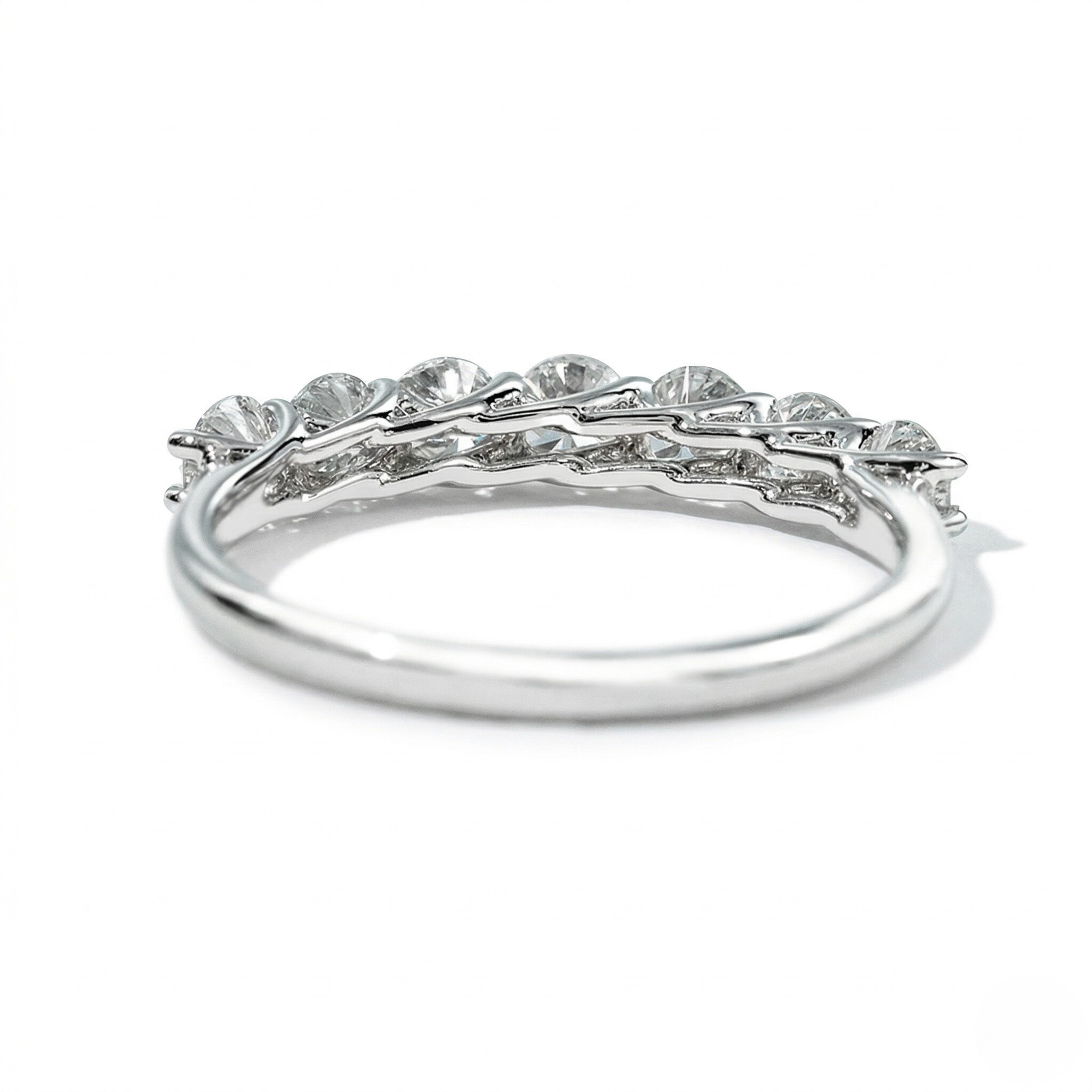 18K white gold lab diamond ring with seven princess-cut stones in a sleek, curved setting