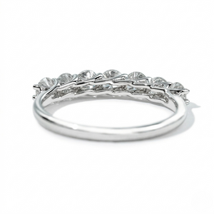 18K white gold lab diamond ring with seven princess-cut stones in a sleek, curved setting