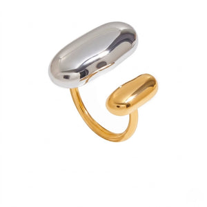 Two-tone gold and silver abstract open ring with oval design elements, modern minimalist style