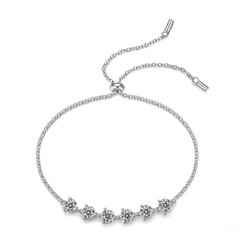 Sterling silver adjustable bolo slider bracelet featuring round cubic Moissanite stone stations shown on a plain white background by J.Collins
