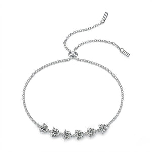 Sterling silver adjustable bolo slider bracelet featuring round cubic Moissanite stone stations shown on a plain white background by J.Collins

