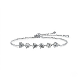 Sterling silver adjustable bolo slider bracelet featuring round cubic Moissanite stone stations shown at an angle on a plain white background by J.Collins

