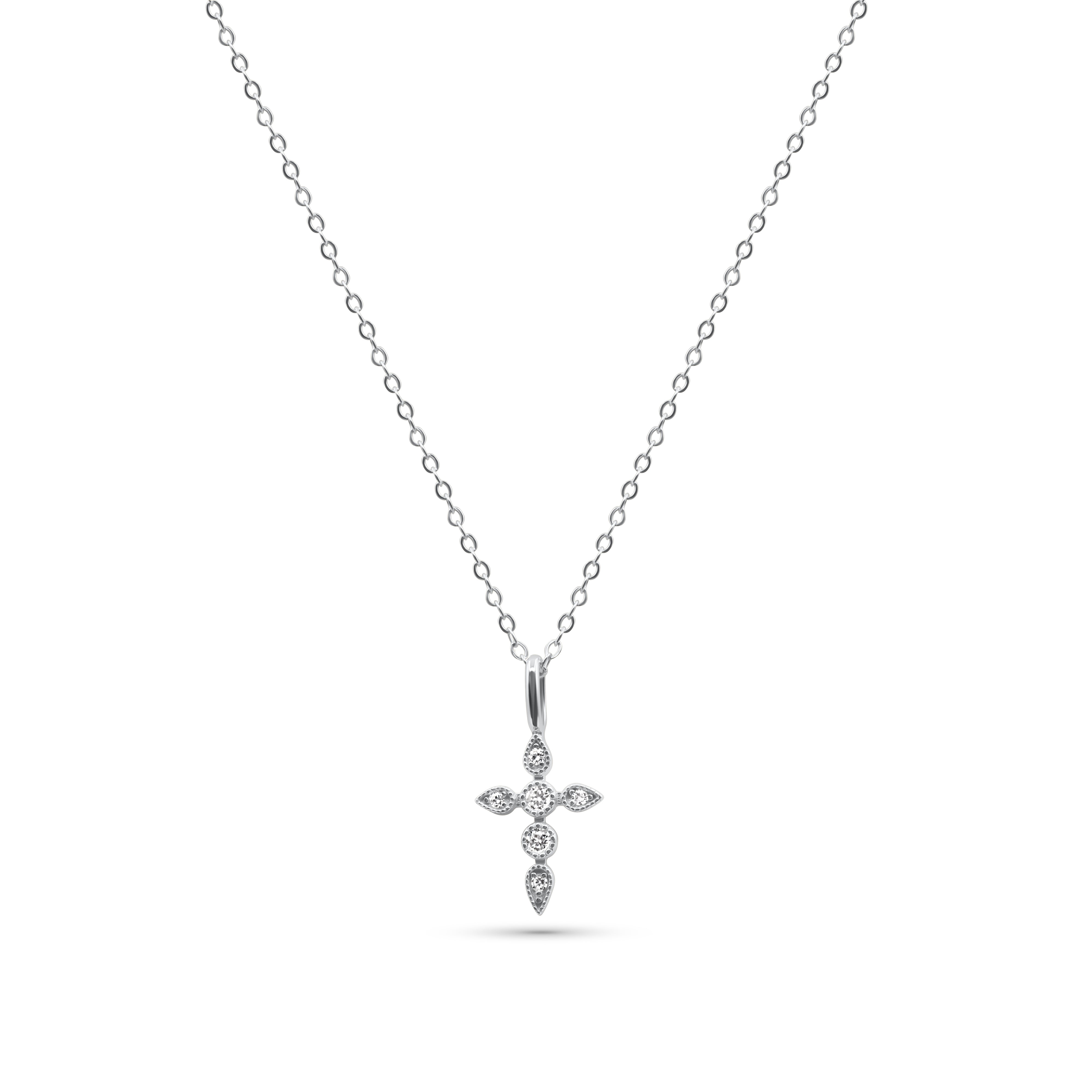 Silver cross pendant necklace on a white chain against a white -Celestial-Pendant-Necklace-JCollinsbackground