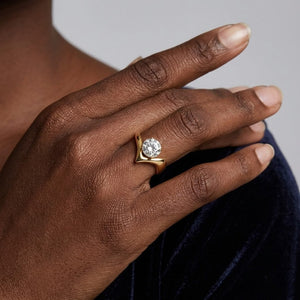 Model Tiffany wearing a modern gold chevron wave ring with a large round diamond solitaire stone | J.Collins Jewelry