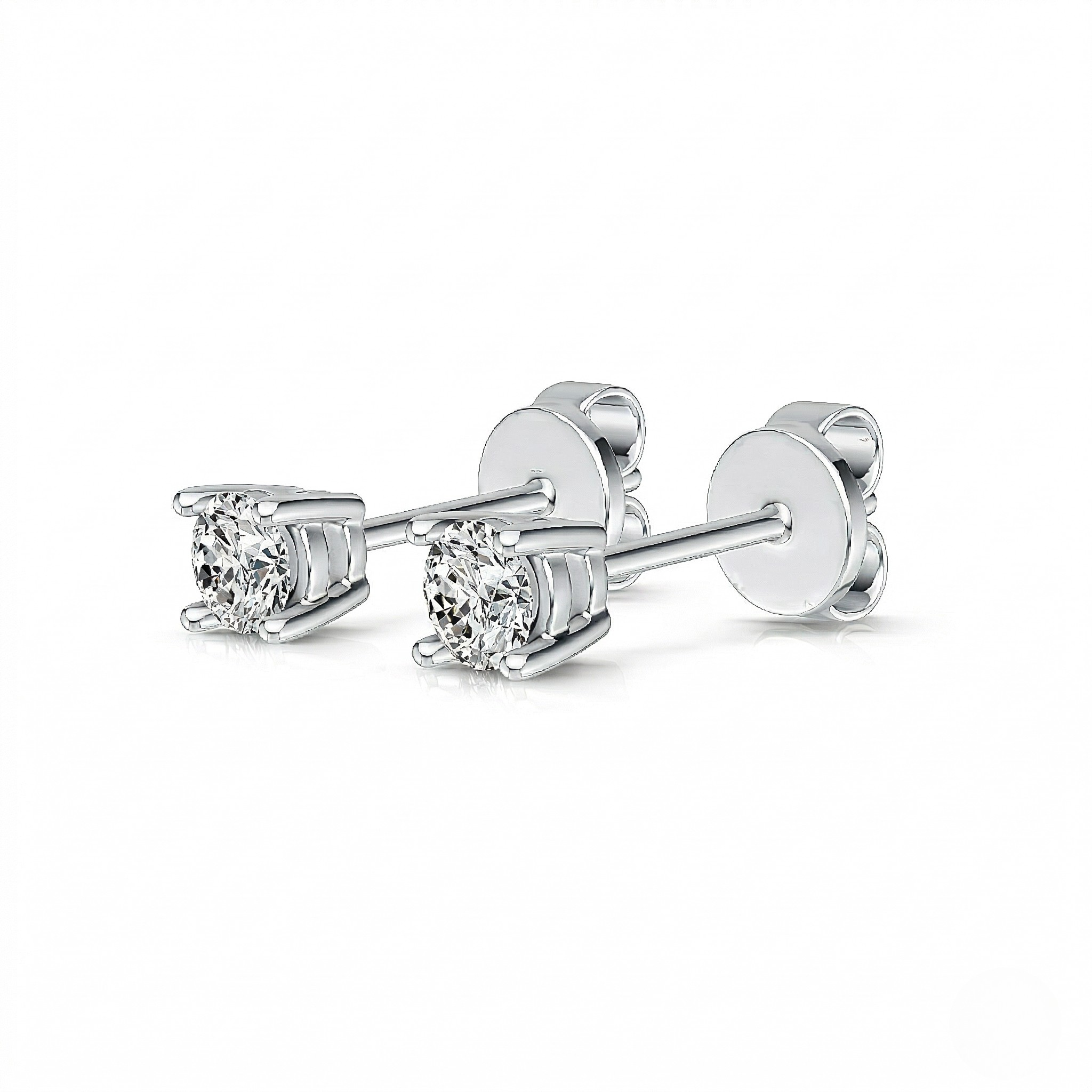 White gold round diamond solitaire stud earrings with four-prong basket setting and butterfly push backs, white background - Diamond Earrings Basket 0.144ct - J. Collins Jewelry 