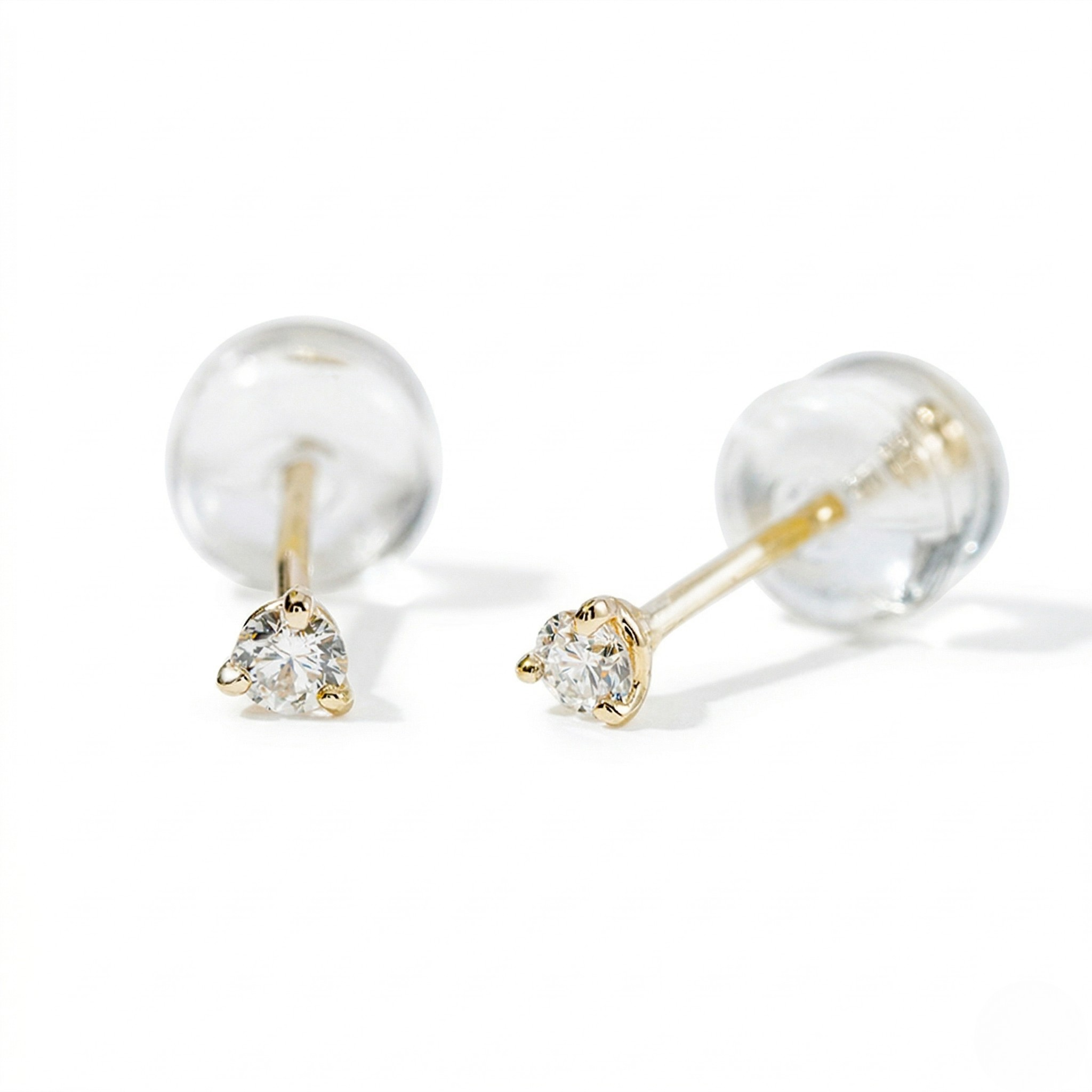 Pair of gold earrings with clear gemstones on a white background - Diamond Earrings Martini 0.05ct - J. Collins Jewelry 