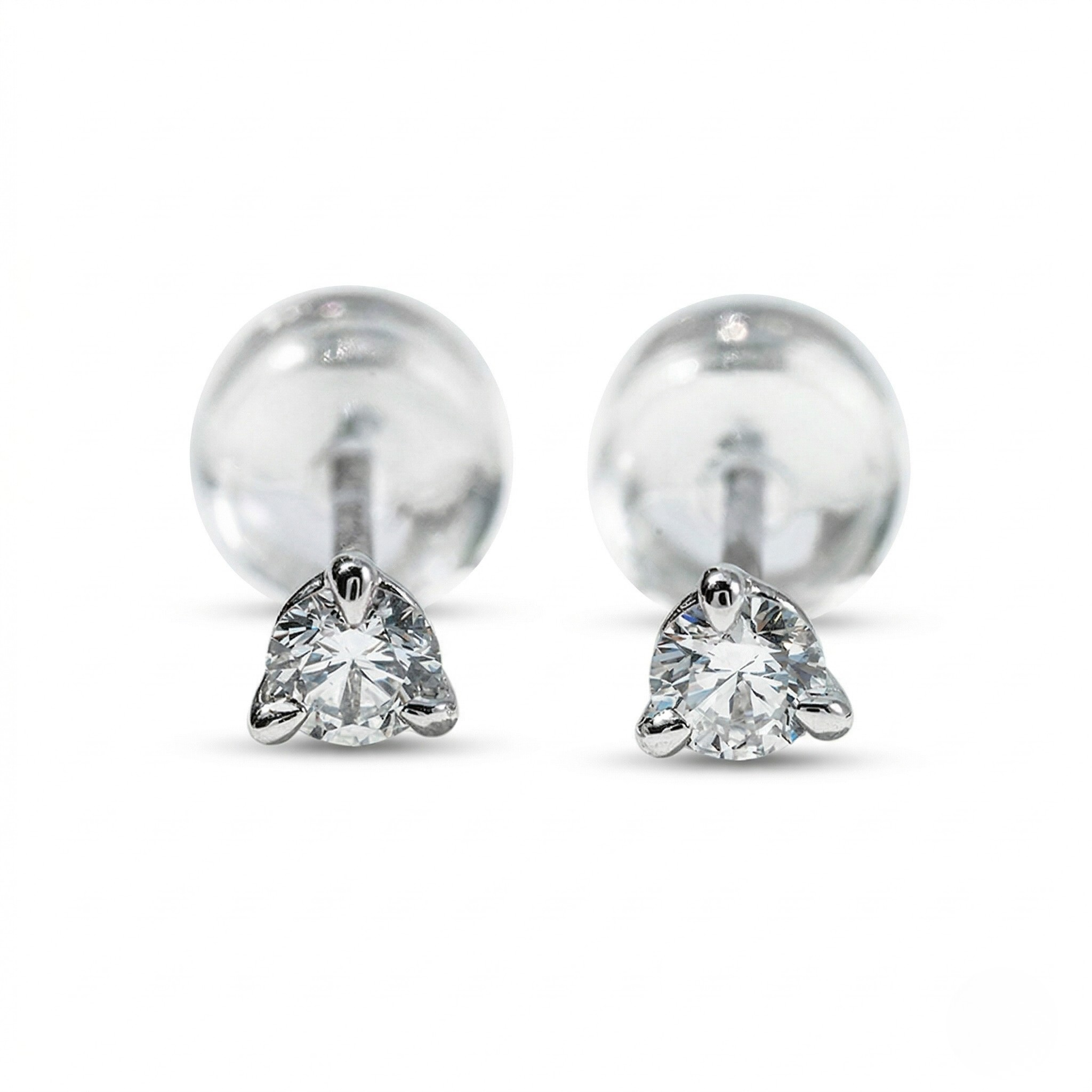 Pair of silver stud earrings with heart-shaped gemstones on a white background - Diamond Earrings Martini 0.1ct - J. Collins Jewelry 
