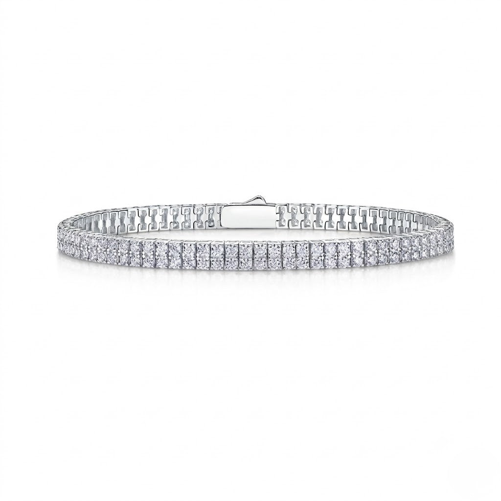 Double-row sterling silver tennis bracelet set with round cubic Moissanite crystals featuring a secure box clasp shown on a plain white background by J.Collins

