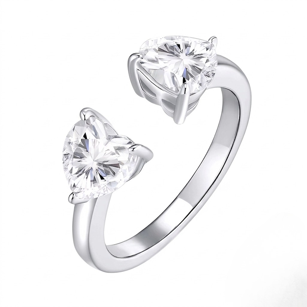 
Sterling silver open adjustable cuff ring featuring dual heart-shaped prong-set cubic Moissanite gemstones by J.Collins
