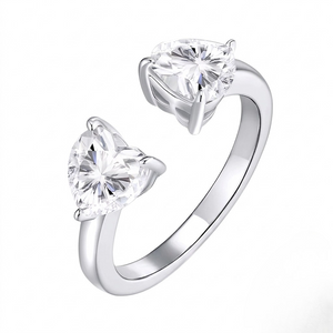 
Sterling silver open adjustable cuff ring featuring dual heart-shaped prong-set cubic Moissanite gemstones by J.Collins
