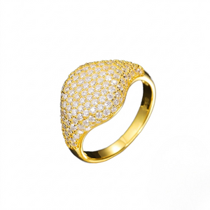 Gold pavè dome signet ring encrusted with clear cubic Moissanite crystals⁠ against a white background. J.Collins 