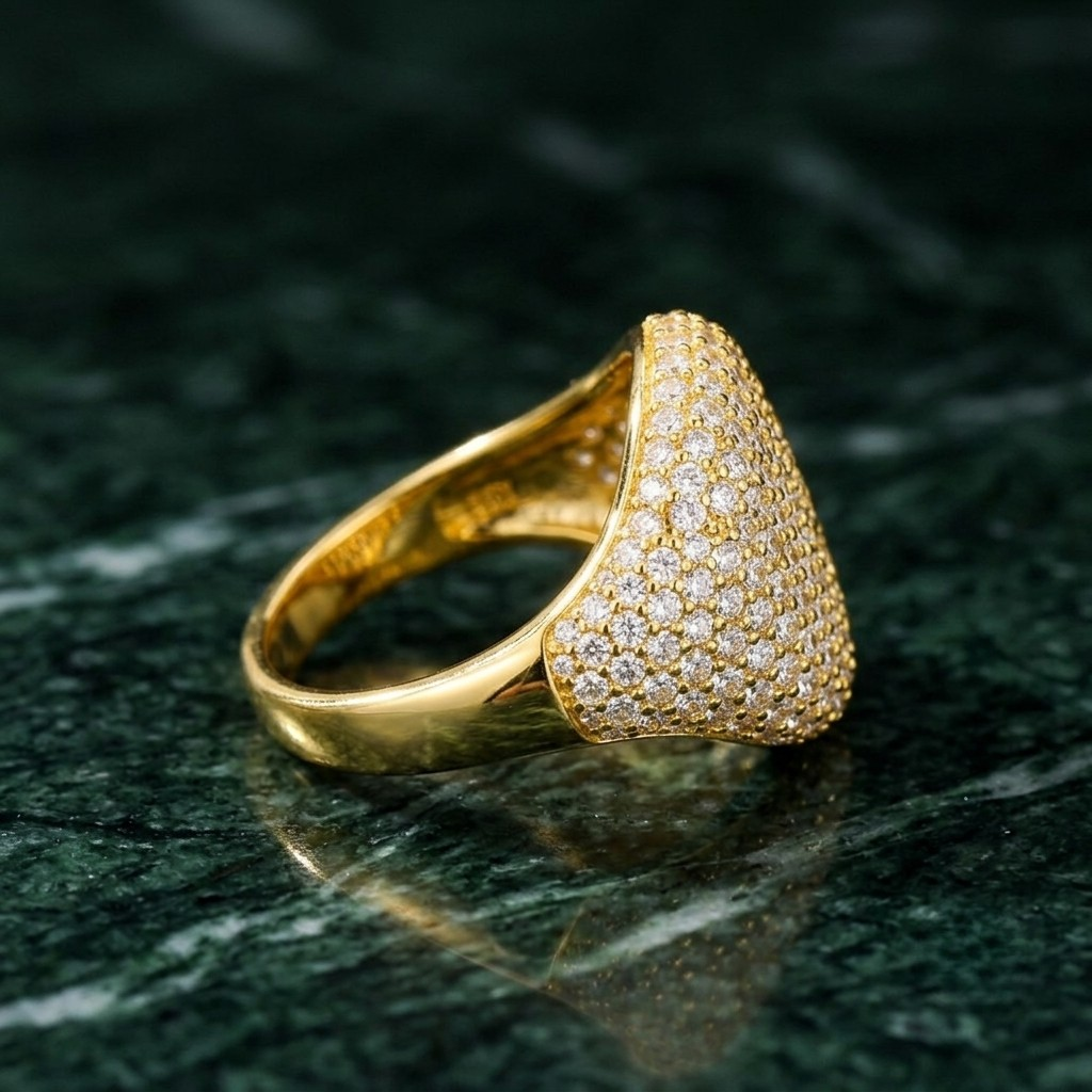 Side profile of gold pavé dome signet ring featuring micro-paved crystal setting by J.Collins⁠  