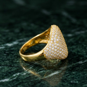 Side profile of gold pavé dome signet ring featuring micro-paved crystal setting by J.Collins⁠  