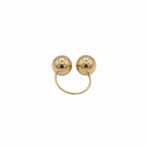 Gold ring with two spherical beads on a white background. J.Collins Jewelry 