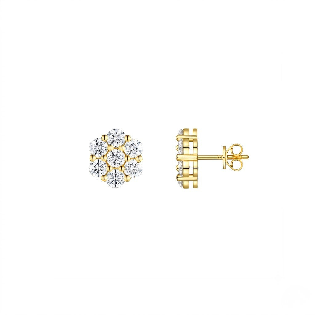 A pair of yellow gold stud earrings, one showing the front view with a cluster of clear gemstones and the other showing the side profile with the post and butterfly back, set against a plain white background. J. Collins Jewelry 