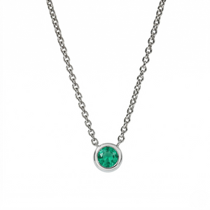Silver necklace with a green gemstone pendant on a white background - Emerald Ne Bezel - J. Collins Jewelry 