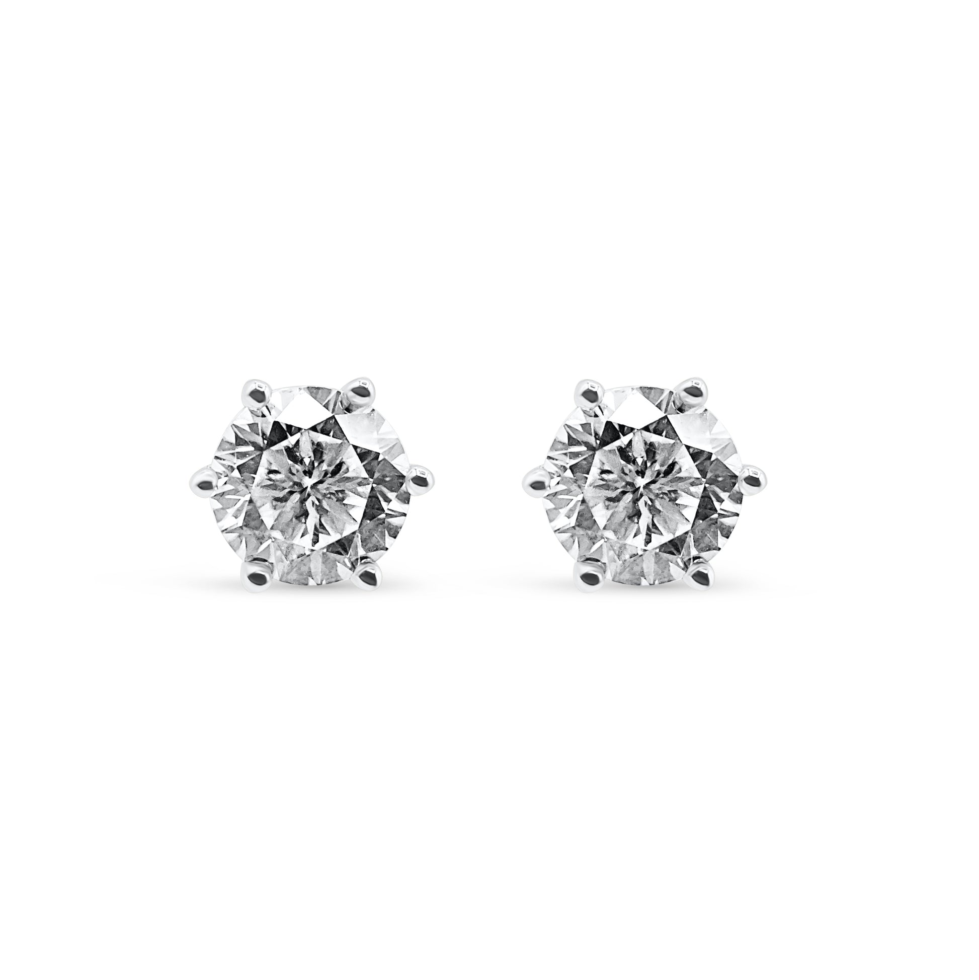 Pair of diamond stud earrings on a white background-Eternal-glow-studs-JCollins Jewelry