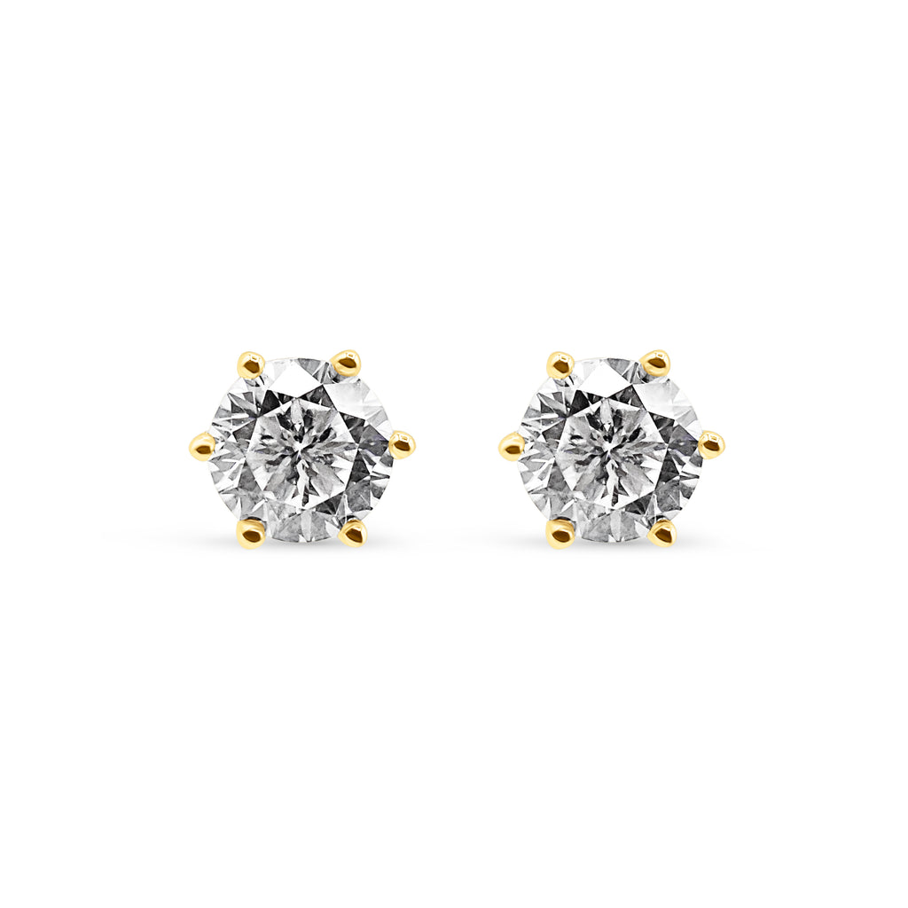 Pair of diamond stud earrings on a white background-Eternal-glow-studs-JCollins Jewelry