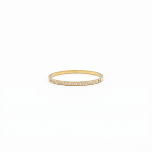 Gold bracelet with small diamonds on a white background-J.Collins Jewelry
