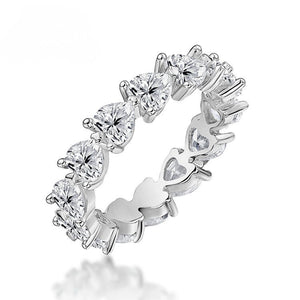 Silver ring with heart-shaped gemstones on a white background-J.Collins Jewelry