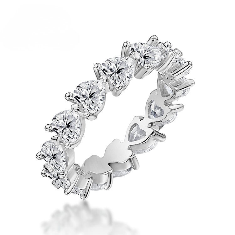 Silver ring with heart-shaped gemstones on a white background-J.Collins Jewelry