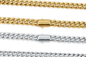 Two gold and silver chain necklaces on a white background
