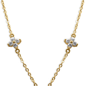 Gold necklace with clover-shaped diamond pendants on a white background- J.Collins Jewelry