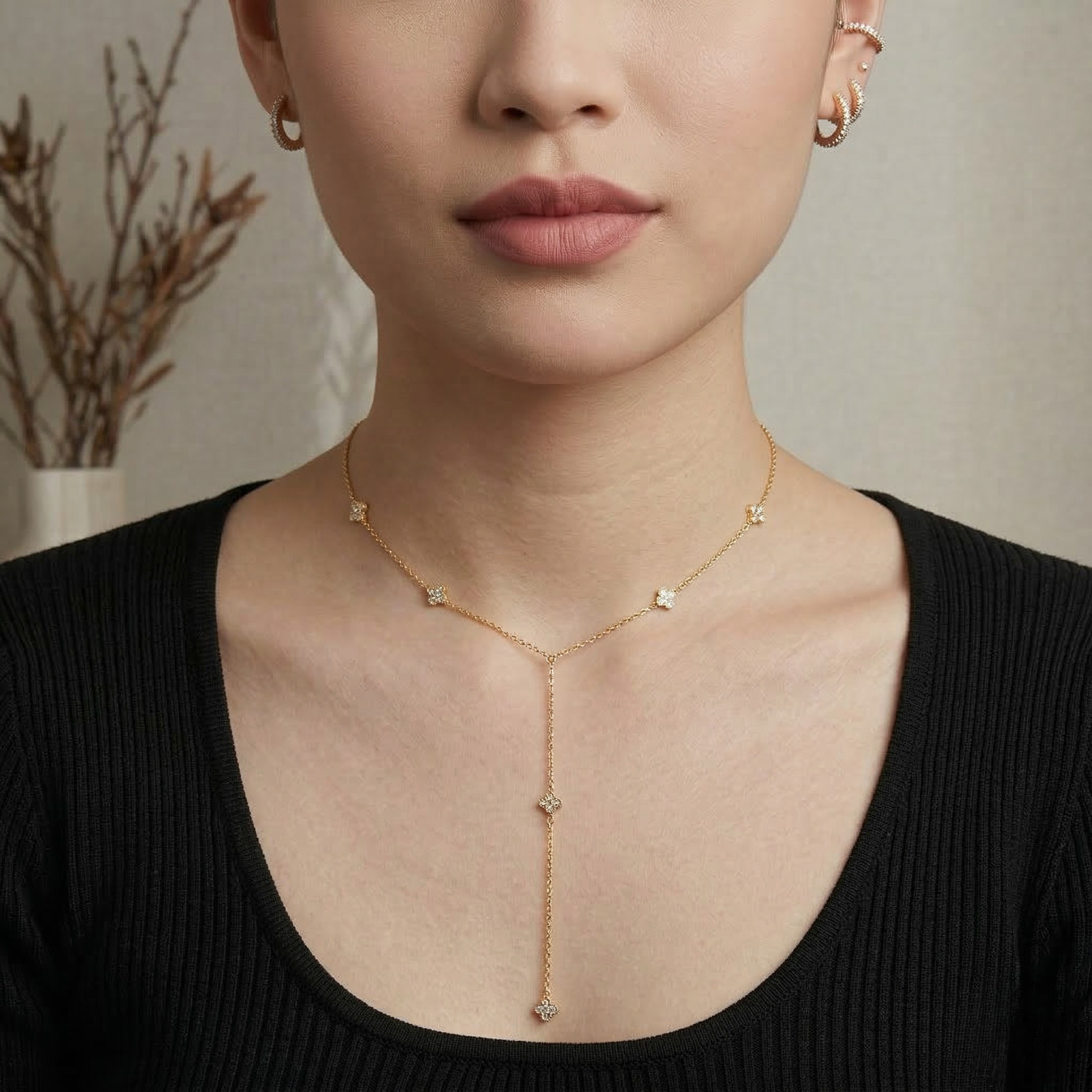 Gold necklace worn by a person with a neutral background-J.Collins Jewelry