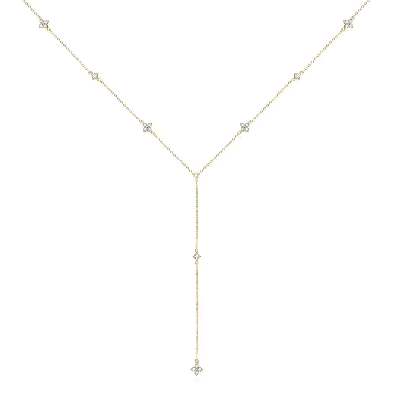 Gold necklace with small diamonds on a white background-J.Collins Jewelry