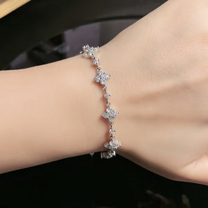 Silver Crystal Star Cluster Chain Bracelet Close-Up on Female Wrist - Flower Cluster Station Bracelet - J. Collins Jewelry 