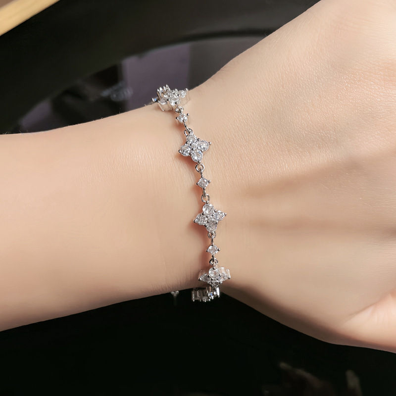 Silver Crystal Star Cluster Chain Bracelet Close-Up on Female Wrist - Flower Cluster Station Bracelet - J. Collins Jewelry 