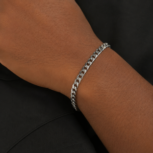 Close up of a male model wearing a silver Franco link bracelet on wrist, bold men's chain minimalist accessory - J.Collins Jewelry