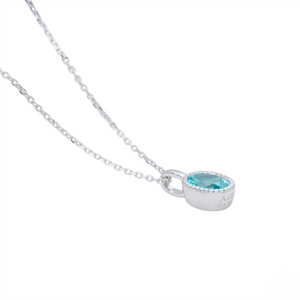 Silver necklace with a blue gemstone pendant on a white background - J Collins Jewelry 