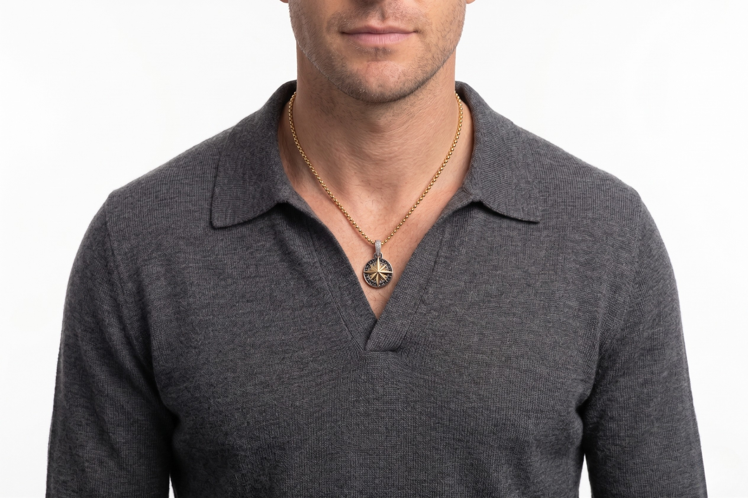 Man wearing a gray polo shirt with a Gold Medallion on a white background- J.ollins Jewelry