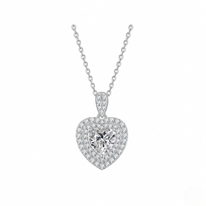 Heart-shaped diamond pendant on a white background