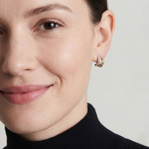 Woman wearing double bind earrings with a neutral background-J.Collins Jewelry