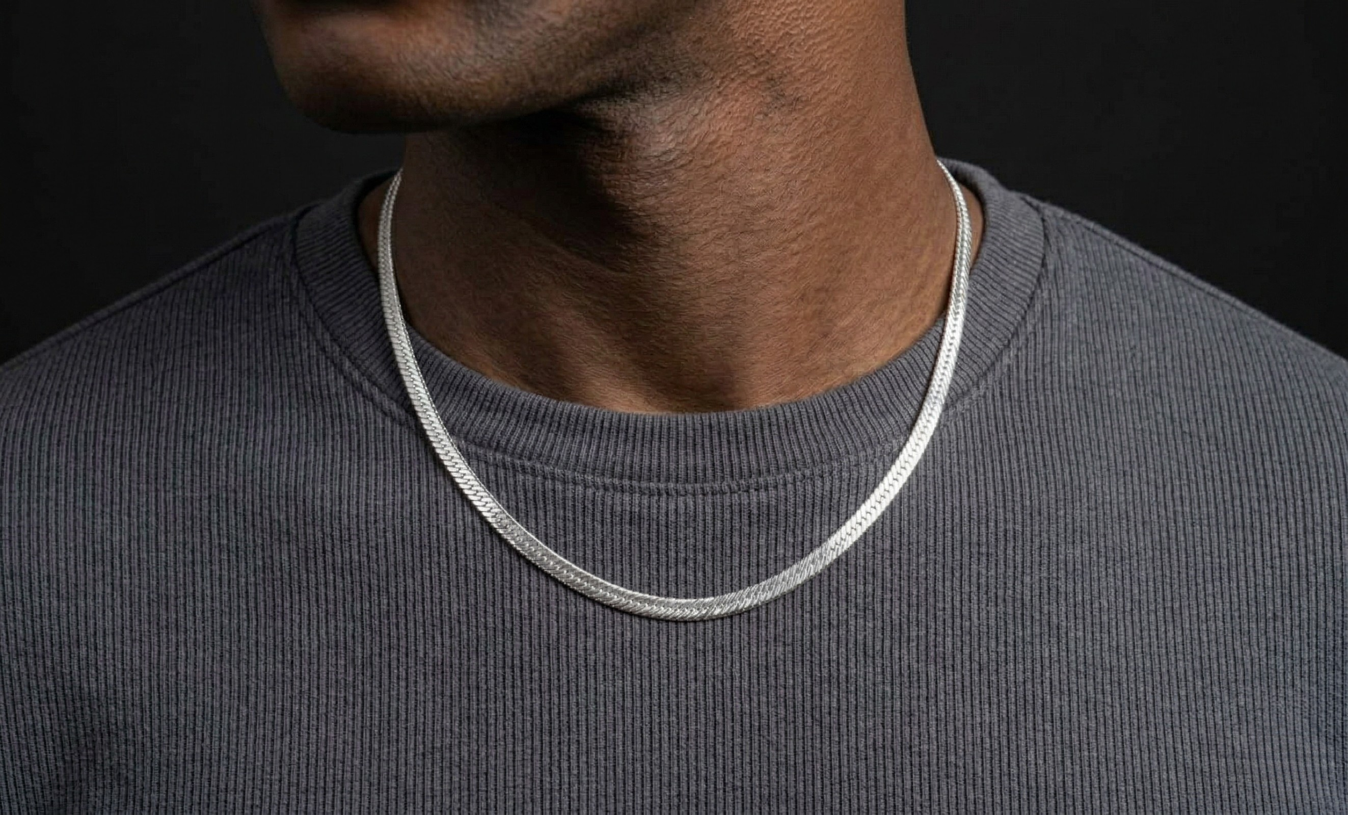Model wearing a silver herringbone necklace - J.Collins Jewelry