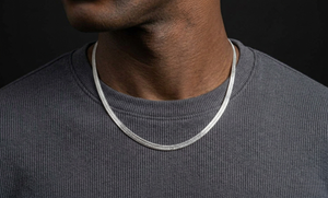 Model wearing a silver herringbone necklace - J.Collins Jewelry
