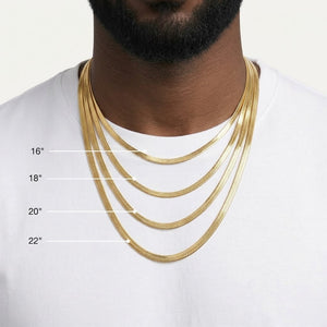 A close-up of a man's neck and chest wearing four layered GOLD Herringbone chain necklaces at different lengths, with size labels 16", 18", 20", and 22" overlaid on the image.