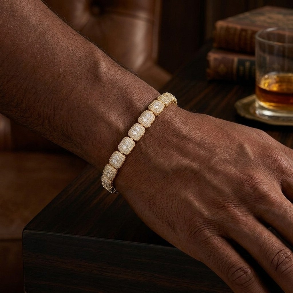 Close-up of a man wearing a yellow gold diamond cluster link bracelet against a dark wooden table background⁠ - J.Collins Jewelry