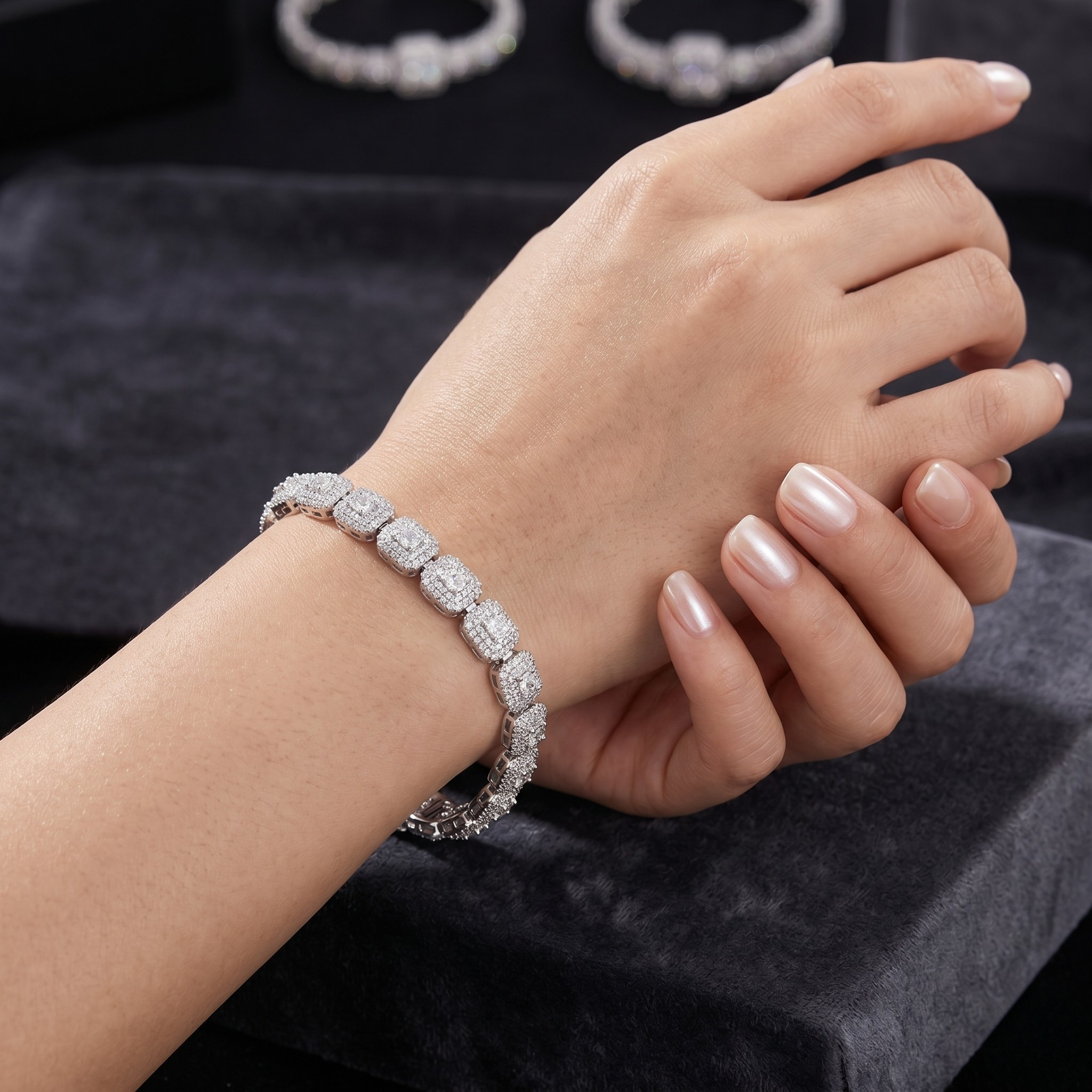 Hand wearing a diamond bracelet on a dark background - Iced Curb Chain Bracelet - J. Collins Jewelry 