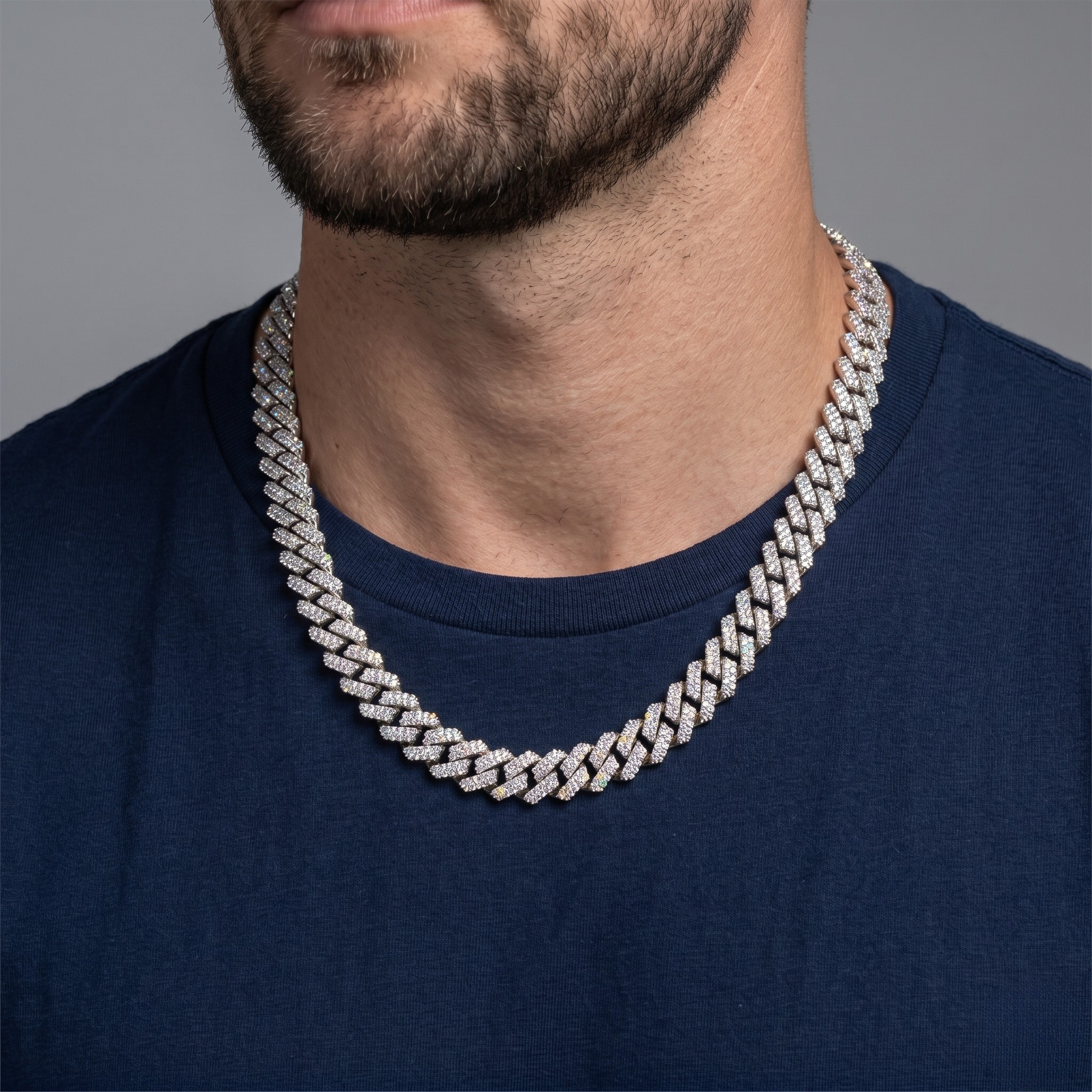 Man wearing a diamond-studded chain necklace on a gray background - Iced_Out_Cuban_10mm - J. Collins Jewelry 