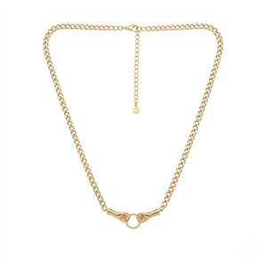 Gold curb chain necklace with a unique twin hand clasp holding a central ring design isolated on a white background | J.Collins Jewelry