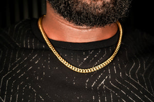 Gold chain necklace worn by a person with a dark shirt -Signature-Franco-Chain-JCollins-Jewelry