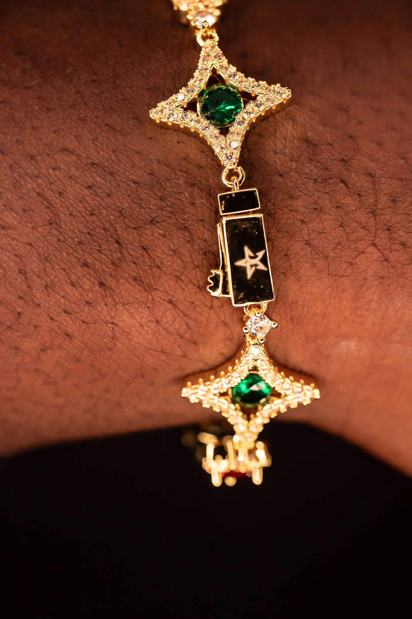 Gold bracelet with green gemstones on a wrist- Multicolor-Gemstone-Bracelet JCollins-Jewelry