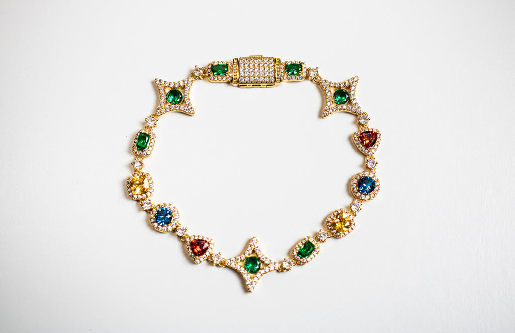 Gold bracelet with colorful gemstones on a white background- Multicolor-Gemstone-Bracelet JCollins-Jewelry